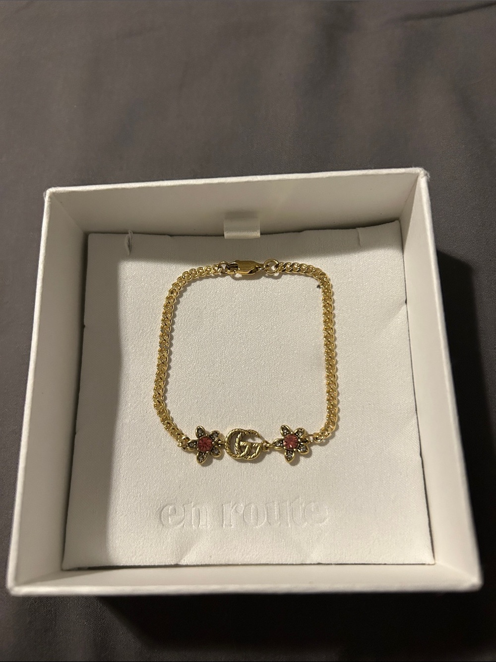 Gold Flower Charm Bracelet with Pink Accents